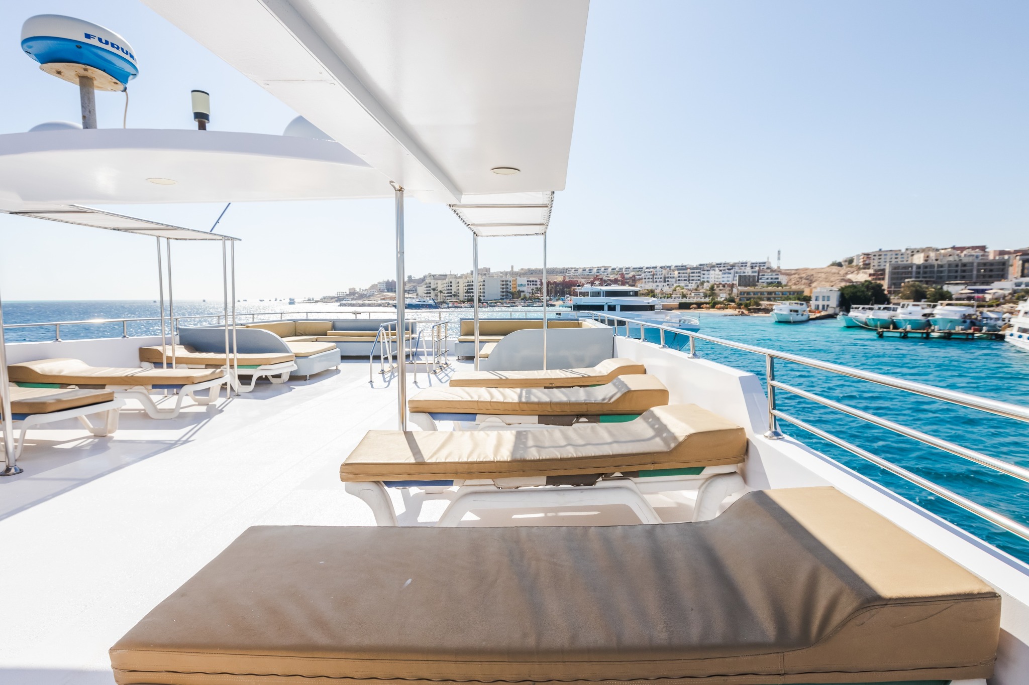 Shaded luxury yacht sundeck overlooking the Red Sea