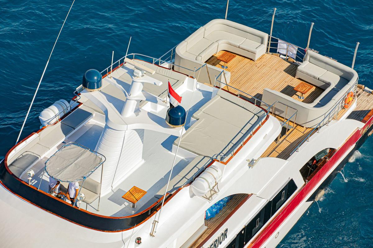 Sundeck of Emperor Superior liveaboard with sunbeds and bean bags seen from above
